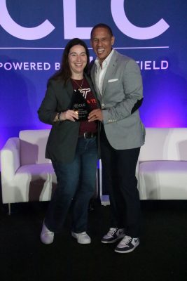 Virginia Tech's Renee Alarid (right) accepts the National Campaign Marketer of the Year award from the College Licensing Company. Photo courtesy of Tammy Purves, Learfield.